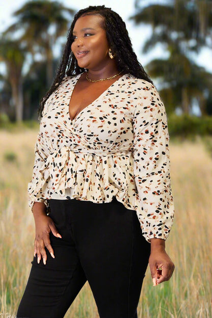 "Bee" Bold In This Printed Peplum Blouse